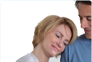 Picture of a woman resting her head on a mans shoulder